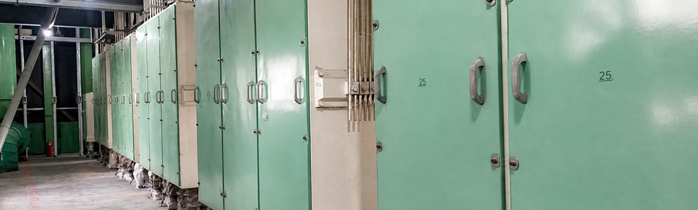 looking down the wheat milling hall: machine rows and the position of the cyclone batteries